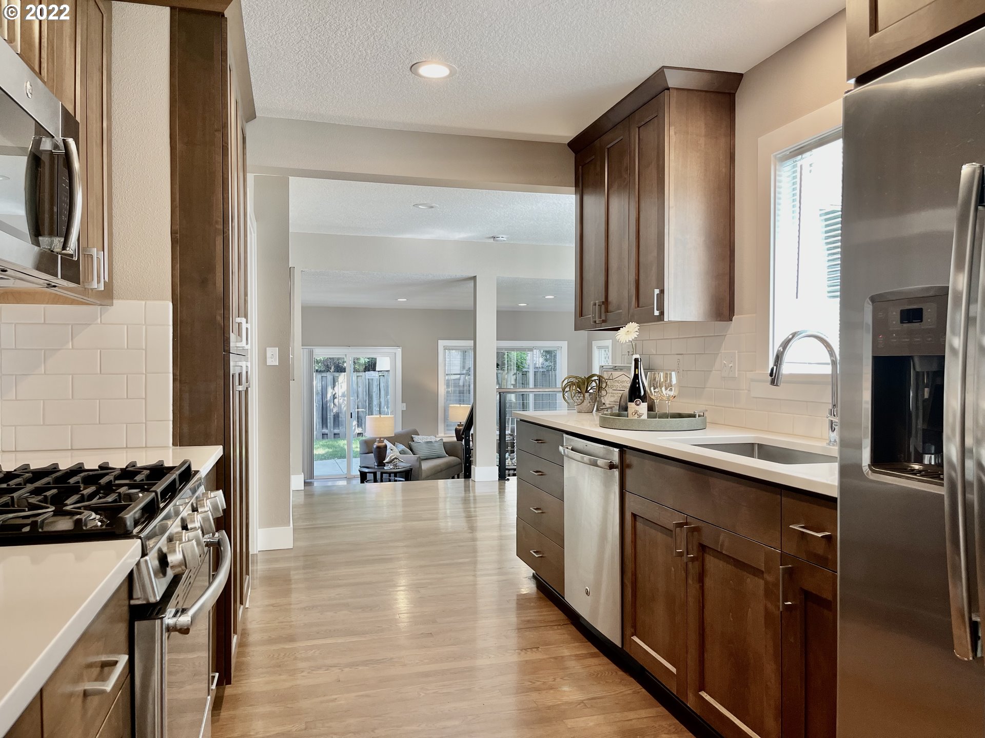 7136 North Chase Avenue Portland, OR 97217 - Photo 8 of 26 a kitchen with stainless steel appliances a sink stove and cabinets