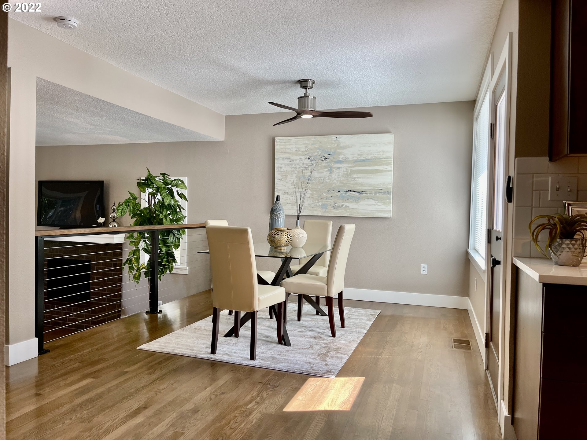 7136 North Chase Avenue Portland, OR 97217 - Photo 9 of 26 a view of a dining room with furniture window and wooden floor