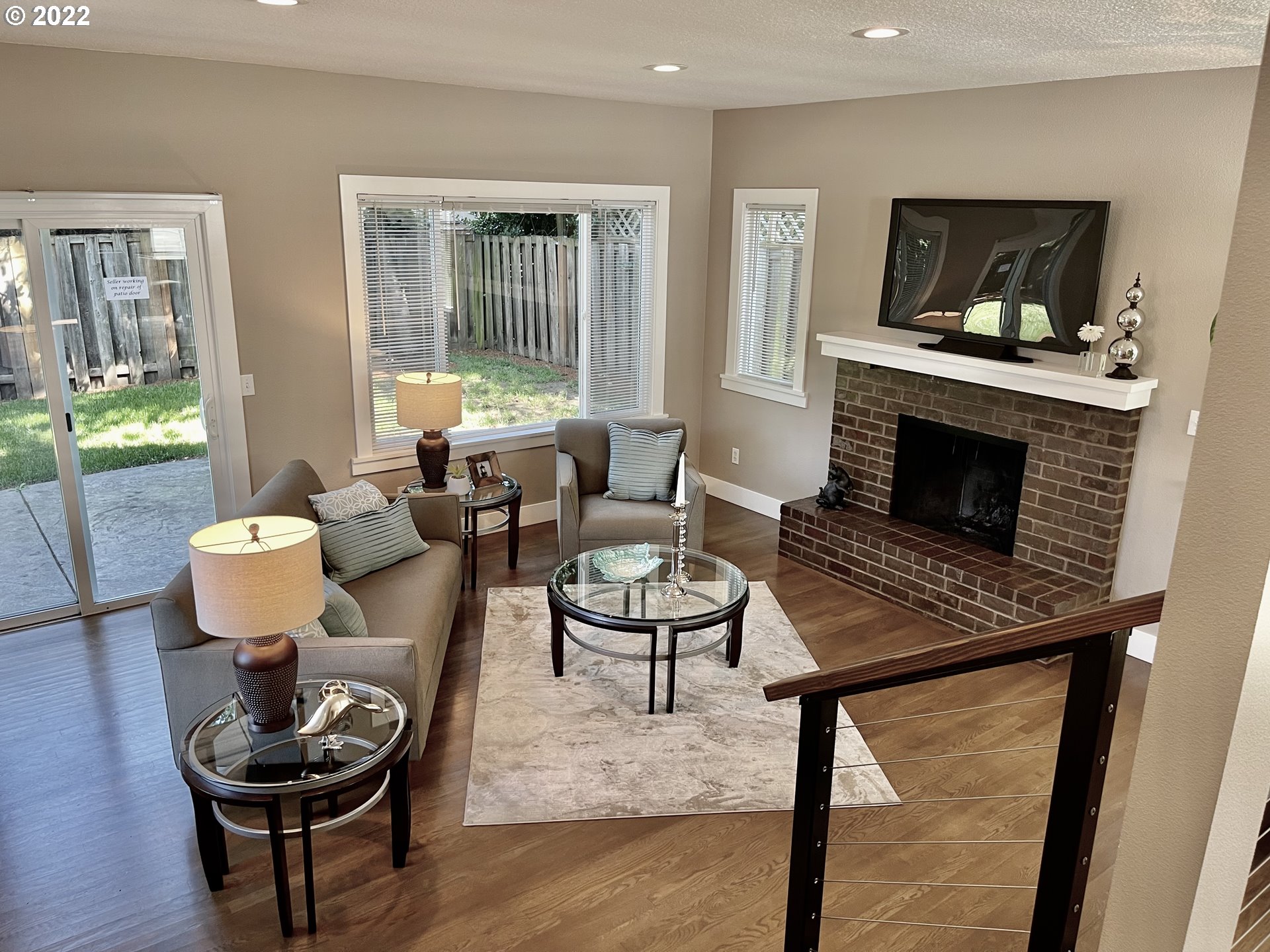 7136 North Chase Avenue Portland, OR 97217 - Photo 10 of 26 a living room with furniture a window and a fireplace