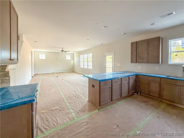 a large bathroom with a large mirror vanity and shower