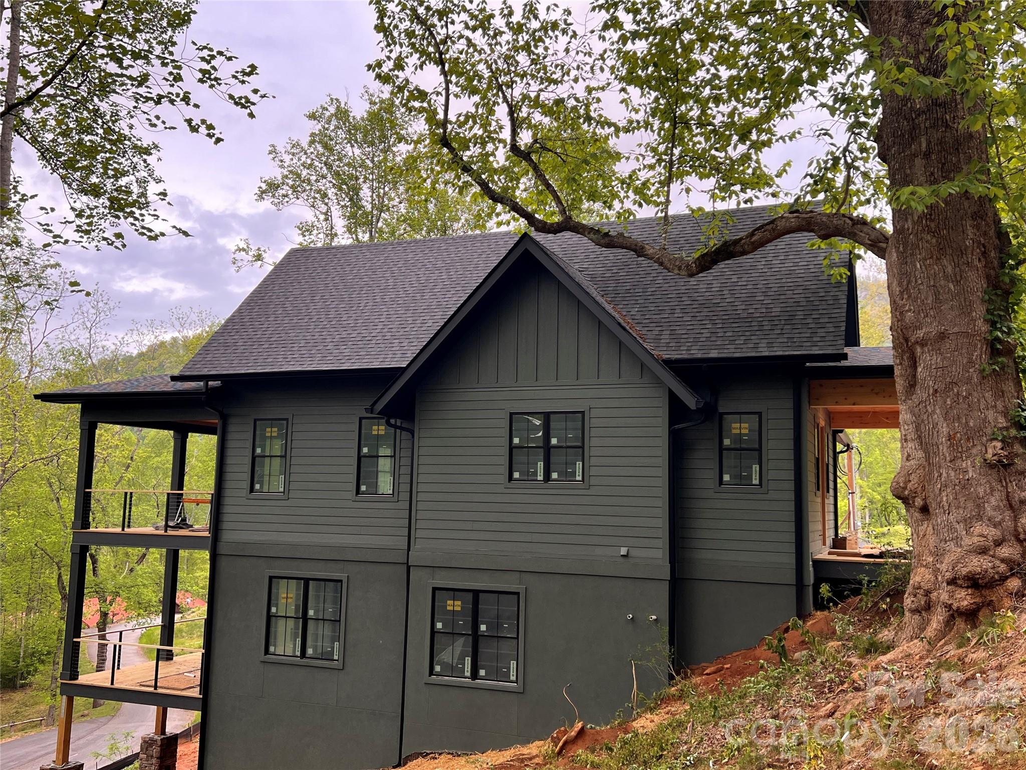 51 Bear Tree Cove Canton, NC 28716 - Photo 12 of 17 a front view of house with yard and trees in the background