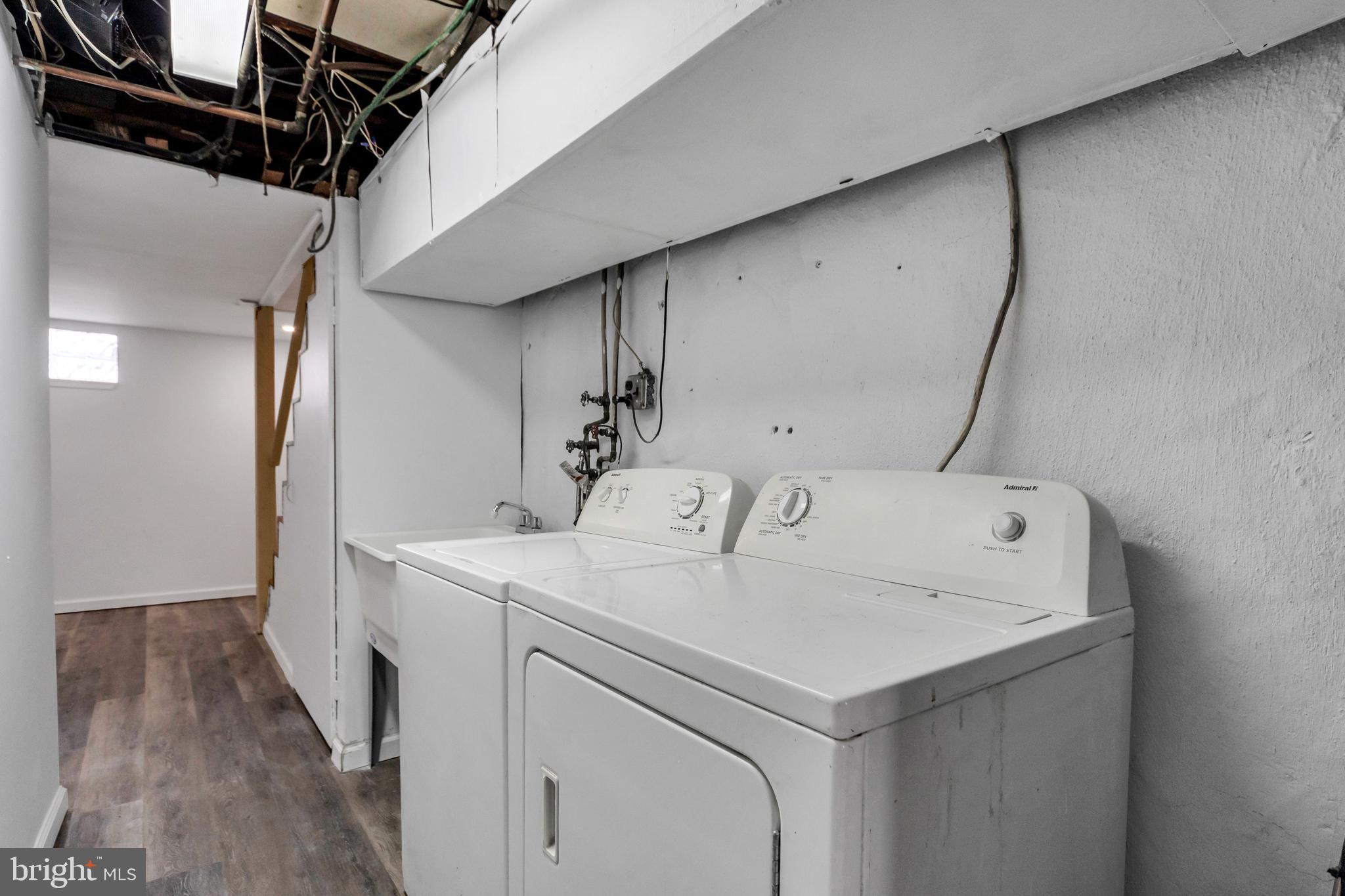 312 Golf Road Darby, PA 19023 - Photo 24 of 27 a utility room with dryer and washer
