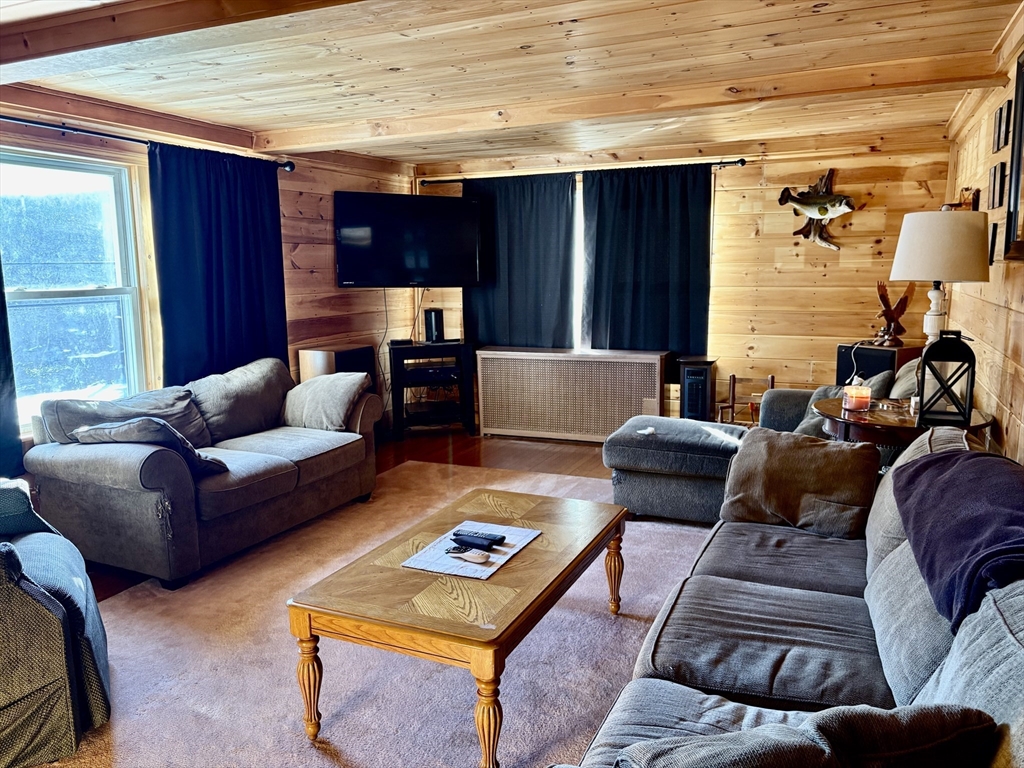 111 Quaboag Street Warren, MA 01083 - Photo 14 of 38 a living room with furniture and a rug