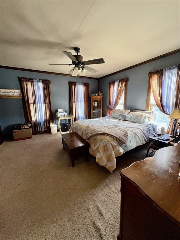 111 Quaboag Street Warren, MA 01083 - Photo 25 of 38 a bedroom with two beds and a chandelier