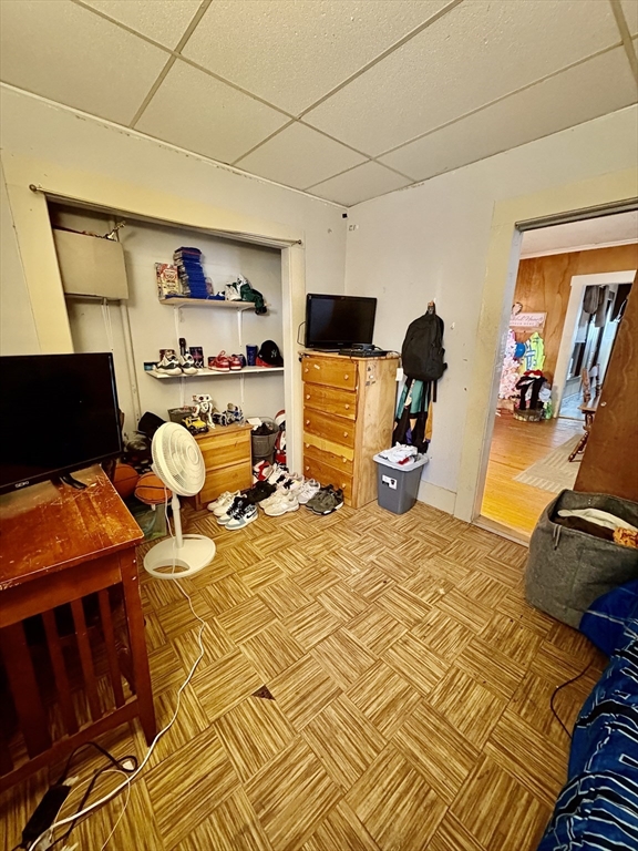 111 Quaboag Street Warren, MA 01083 - Photo 29 of 38 a bedroom with a bed and wooden floor