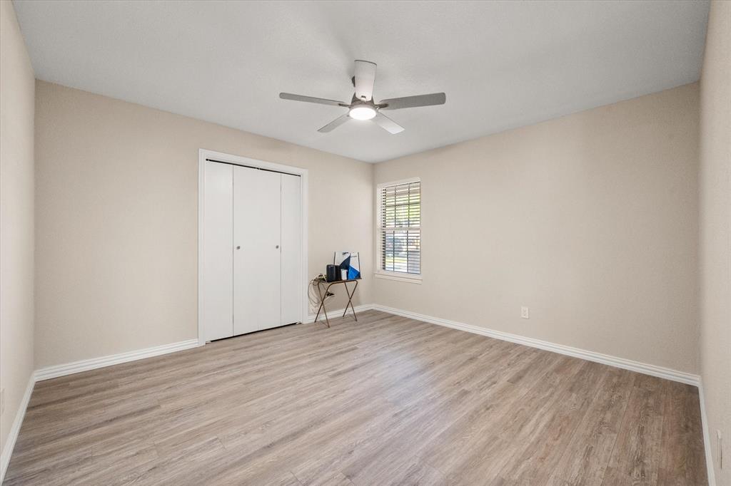 2008 Chalice Road Arlington, TX 76014 - Photo 14 of 28 wooden floor in an empty room with a window