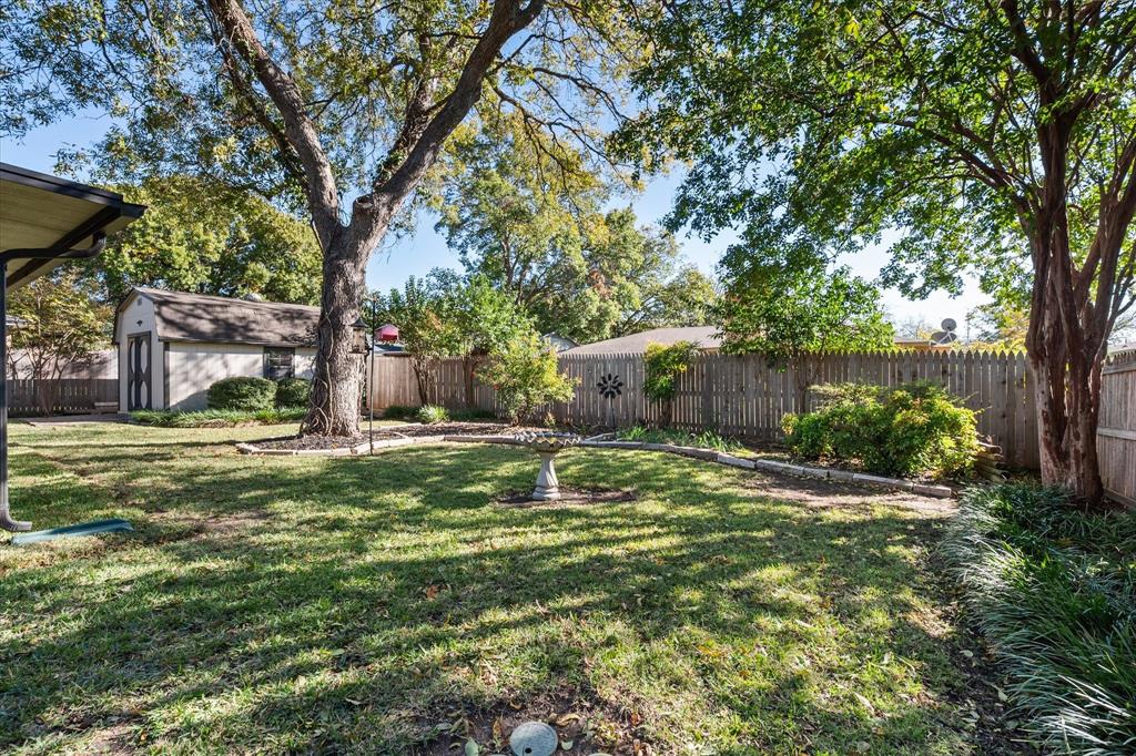 2008 Chalice Road Arlington, TX 76014 - Photo 26 of 28 a backyard of a house with lots of green space