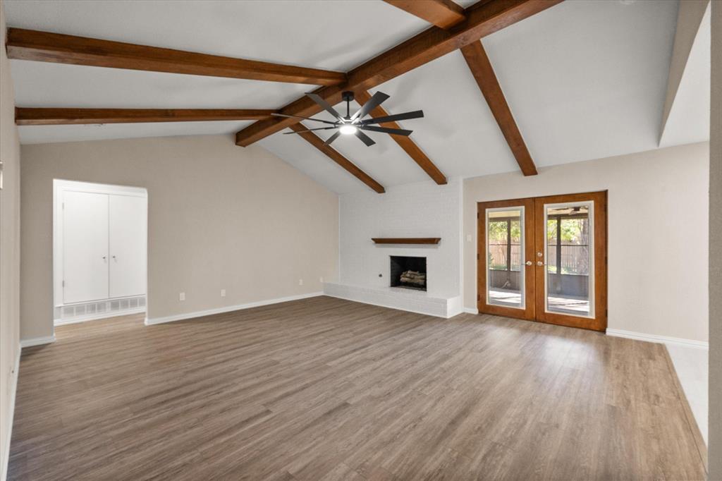 2008 Chalice Road Arlington, TX 76014 - Photo 4 of 28 a view of an empty room with wooden floor and a window