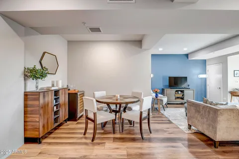 a view of a dining room with furniture and wooden floor