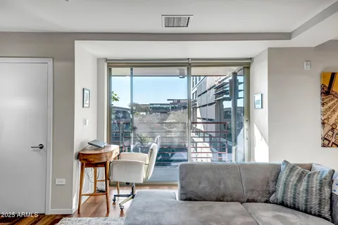 a living room with furniture and a window