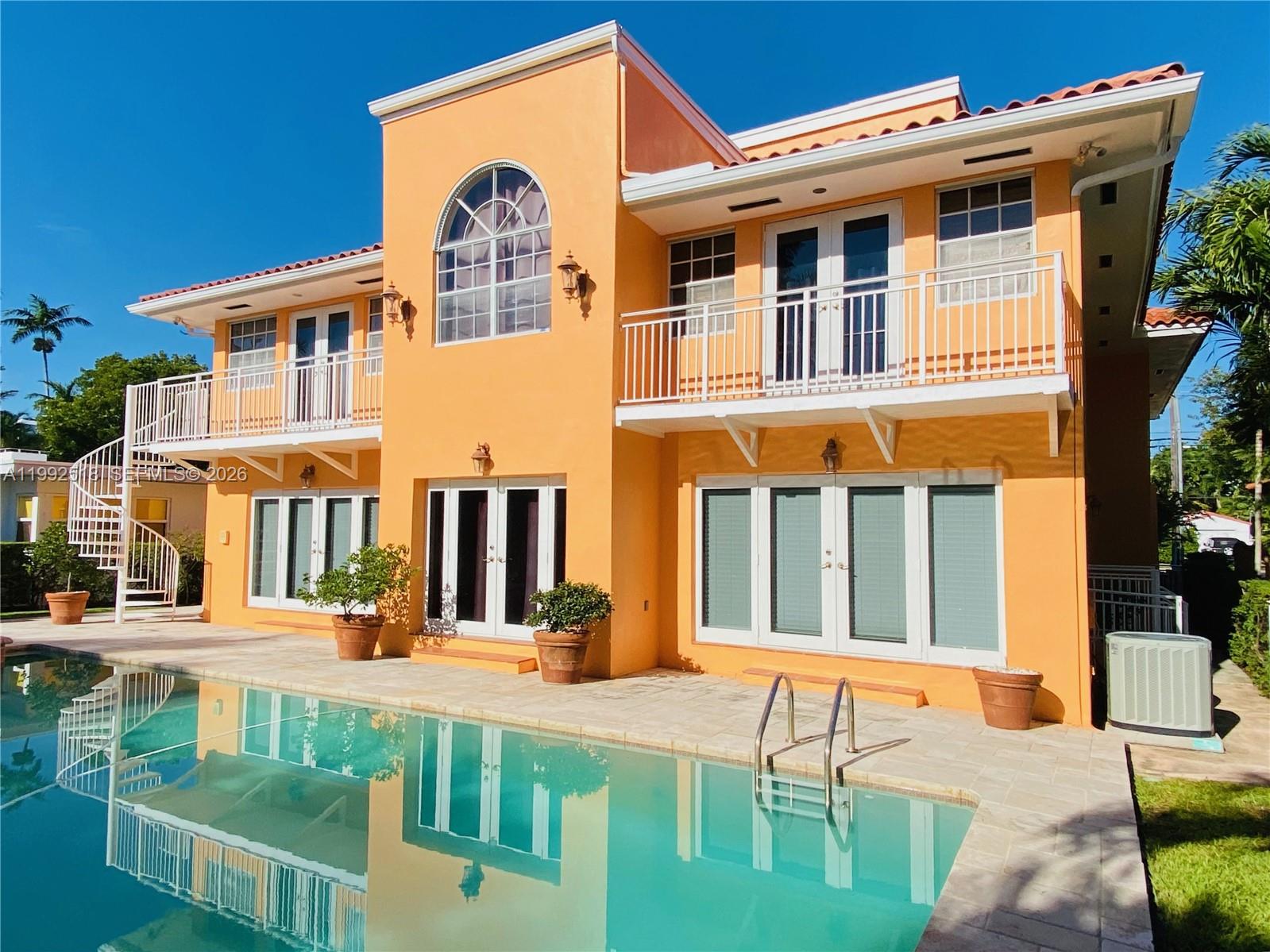 5309 Alton Road Miami Beach, FL 33140 - Photo 35 of 51 a front view of a building with a garden