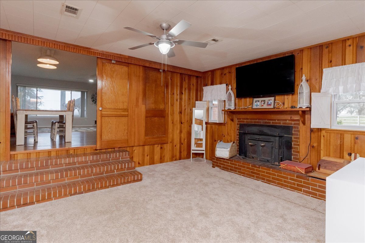 150 Moss Oaks Road Perry, GA 31069 - Photo 24 of 51 a living room with furniture and a flat screen tv