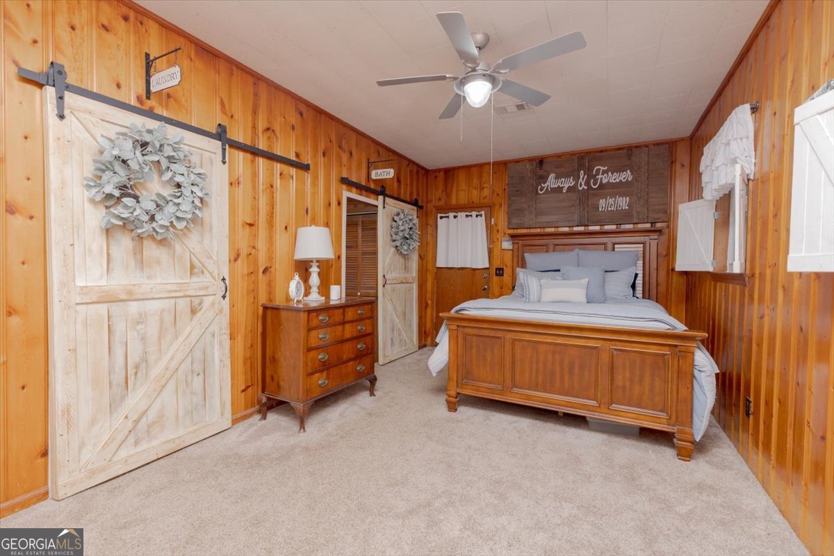 150 Moss Oaks Road Perry, GA 31069 - Photo 26 of 51 a bedroom with a large bed and a window
