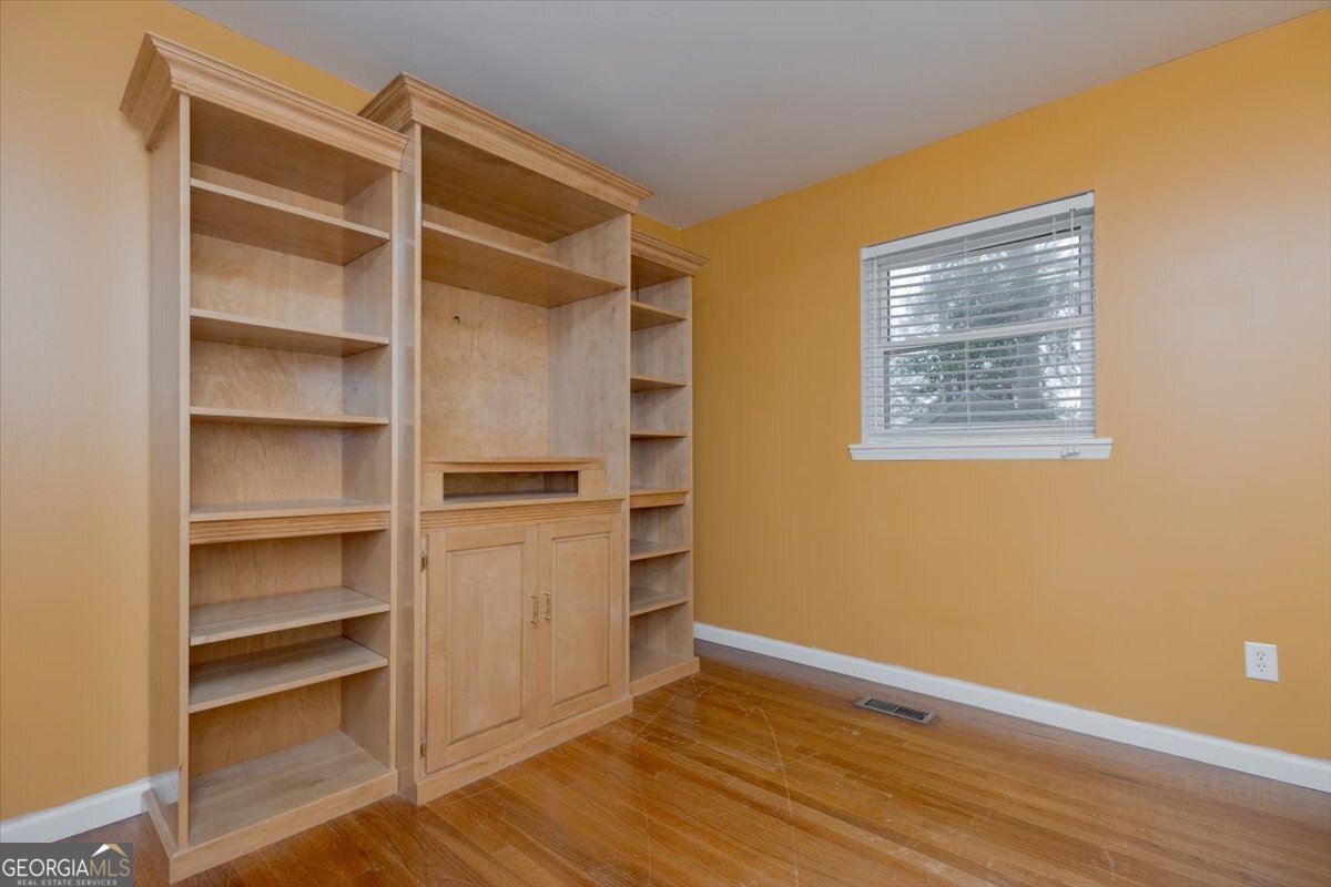 150 Moss Oaks Road Perry, GA 31069 - Photo 38 of 51 a view of an empty room with a closet and wooden floor
