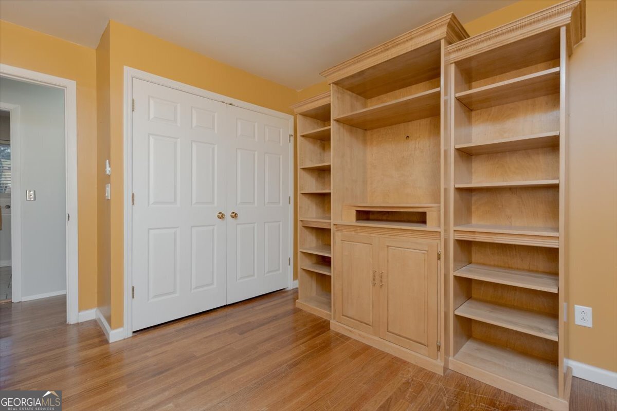 150 Moss Oaks Road Perry, GA 31069 - Photo 39 of 51 a view of walk in closet with empty racks