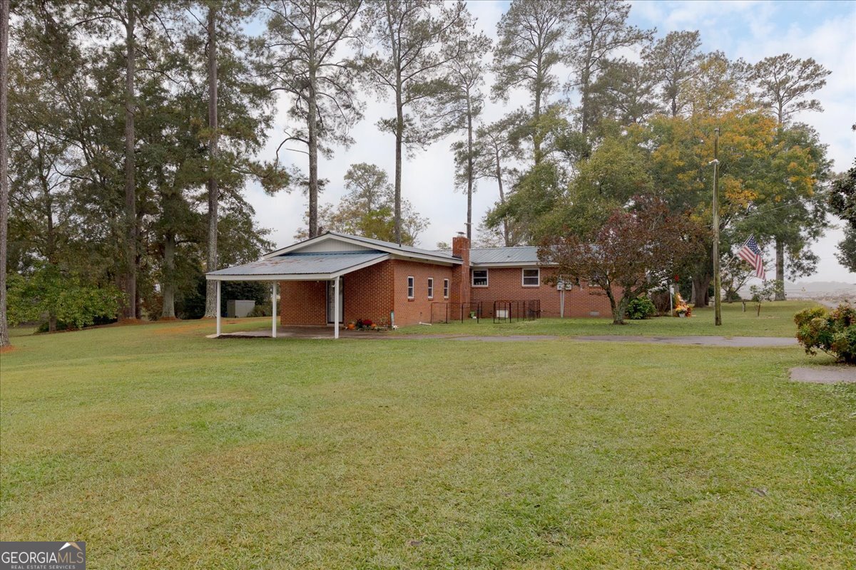 150 Moss Oaks Road Perry, GA 31069 - Photo 41 of 51 a view of a house with a yard