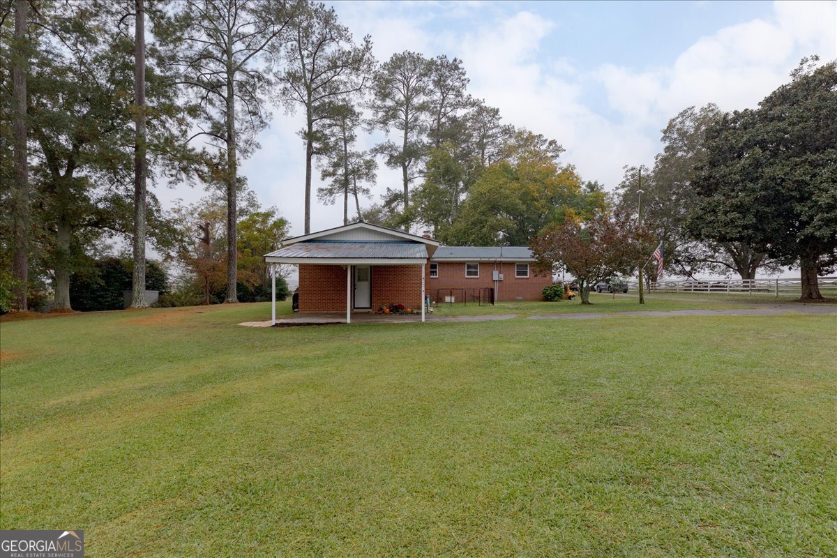 150 Moss Oaks Road Perry, GA 31069 - Photo 42 of 51 a front view of a house with garden