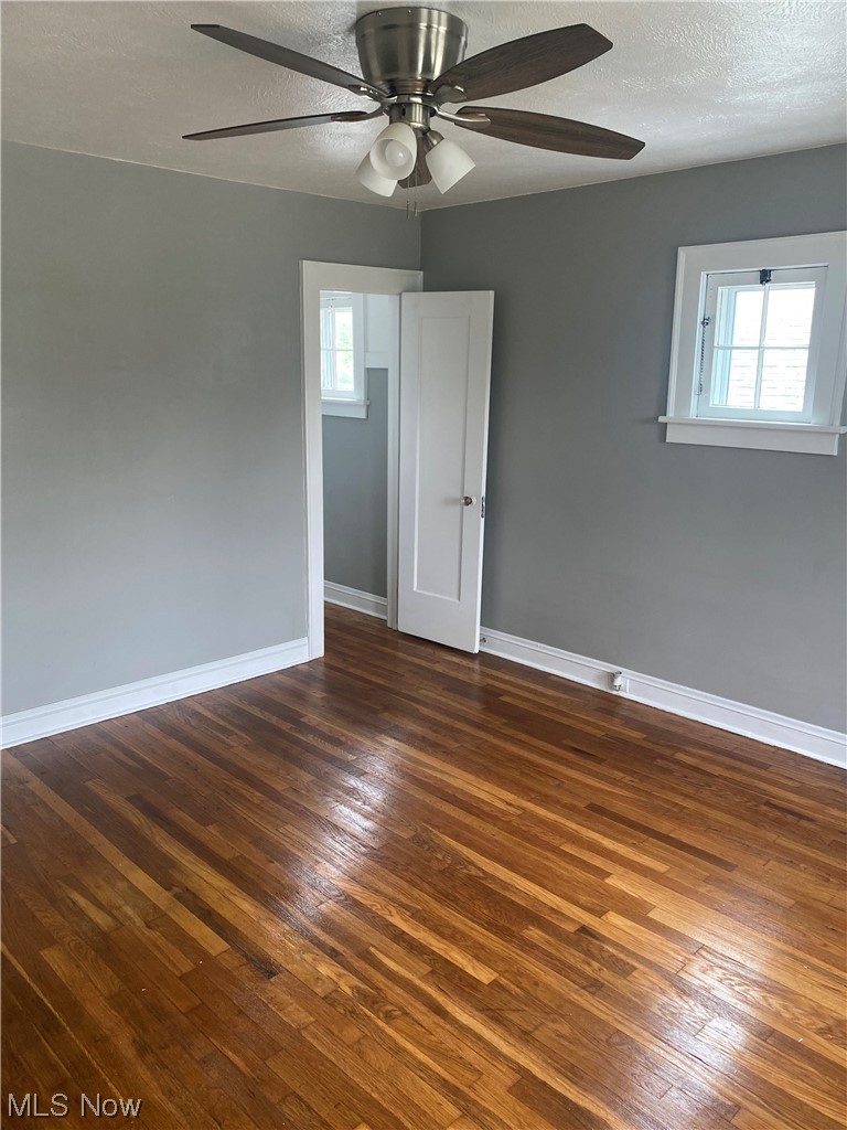 4688 Rockwood Road Cleveland, OH 44125 - Photo 33 of 35 Wood floored spare room with ceiling fan