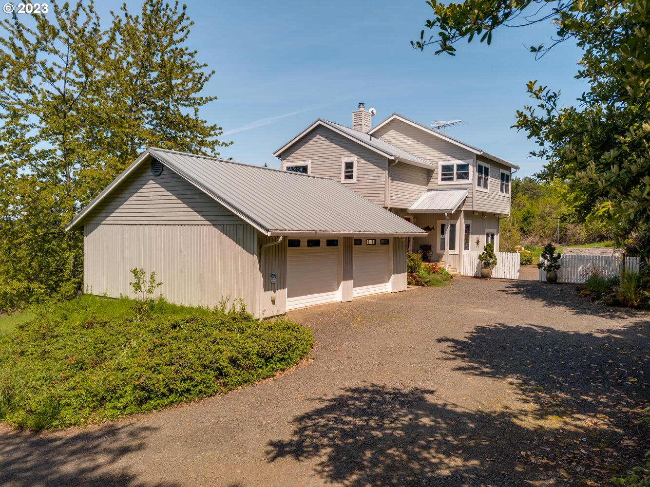 16845 Southeast Walnut Hill Road Amity, OR 97101 - Photo 2 of 48 a front view of a house with a yard and garage