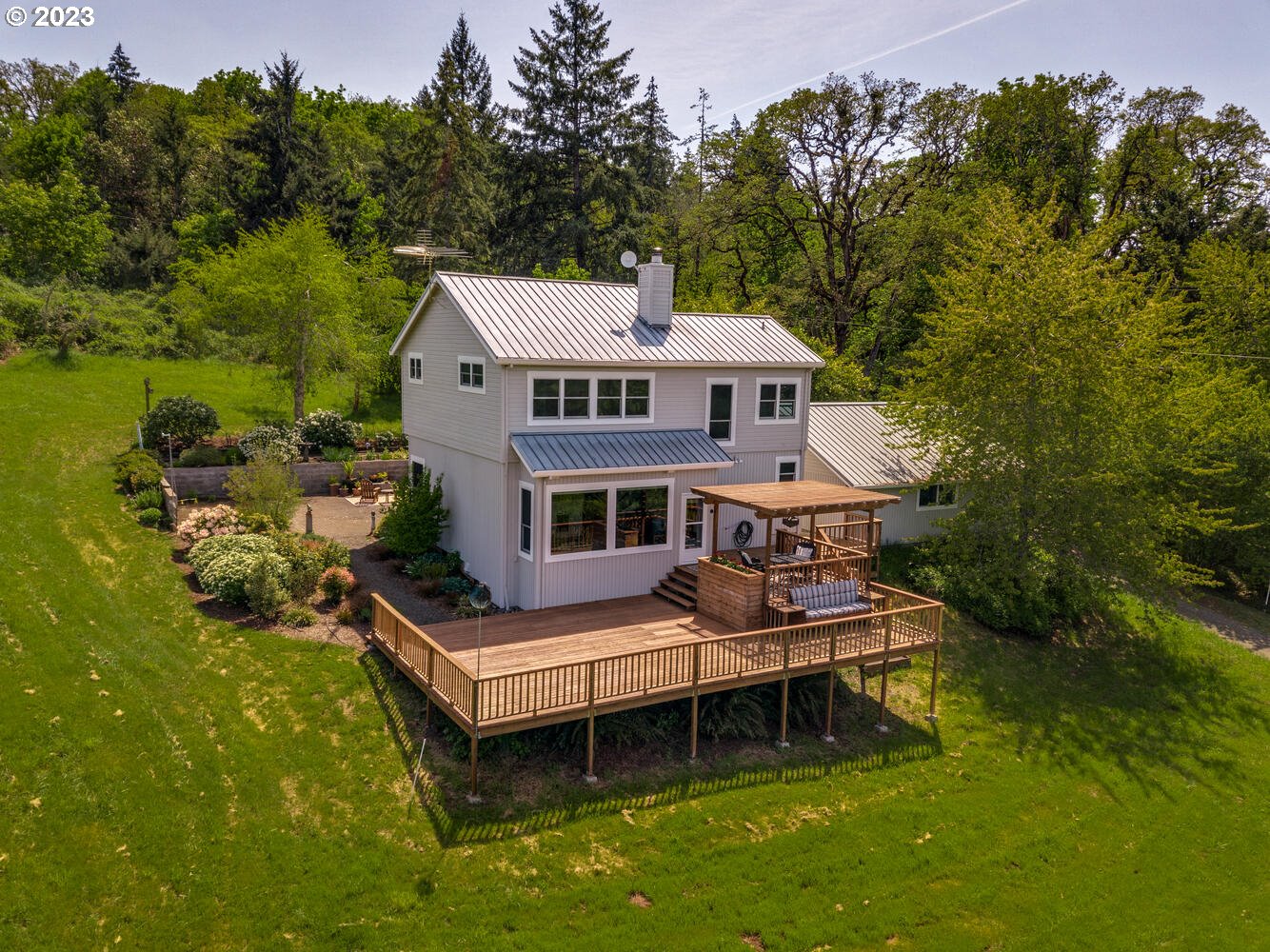 16845 Southeast Walnut Hill Road Amity, OR 97101 - Photo 26 of 48 a view of a house with pool and chairs