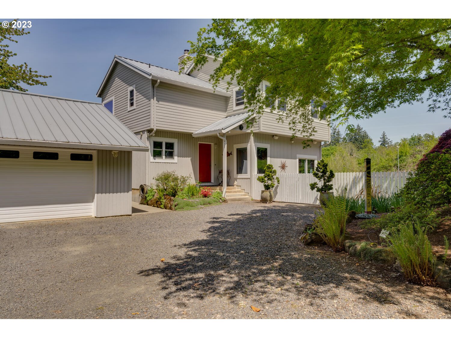 16845 Southeast Walnut Hill Road Amity, OR 97101 - Photo 3 of 48 a front view of a house with garden