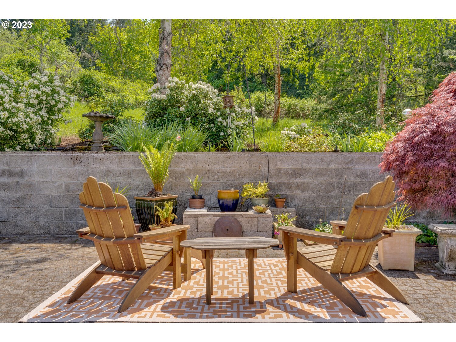 16845 Southeast Walnut Hill Road Amity, OR 97101 - Photo 36 of 48 a backyard of a house with table and chairs
