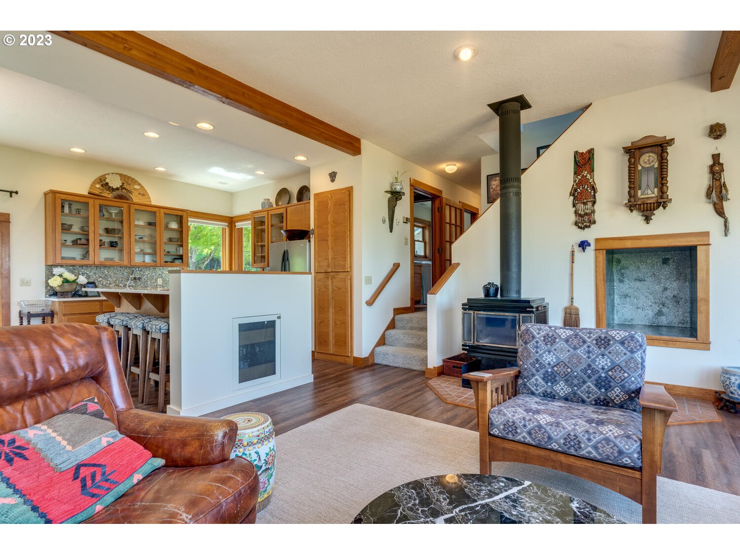 16845 Southeast Walnut Hill Road Amity, OR 97101 - Photo 8 of 48 a living room with furniture and a fireplace