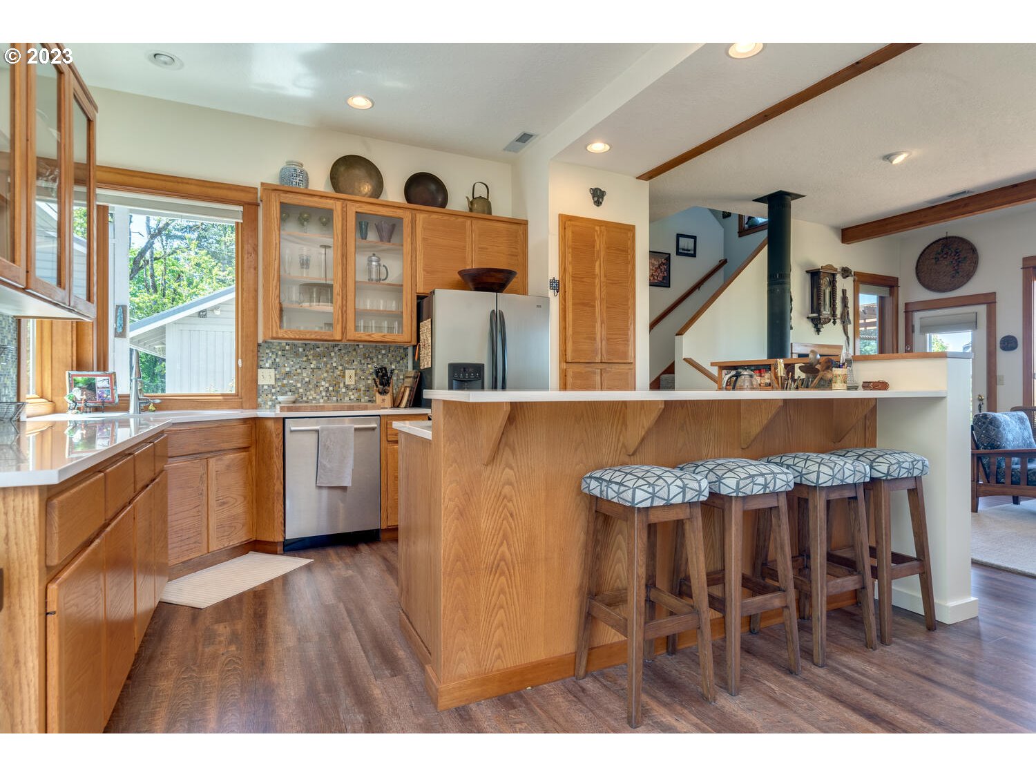 16845 Southeast Walnut Hill Road Amity, OR 97101 - Photo 10 of 48 a kitchen with a table chairs stove and cabinets