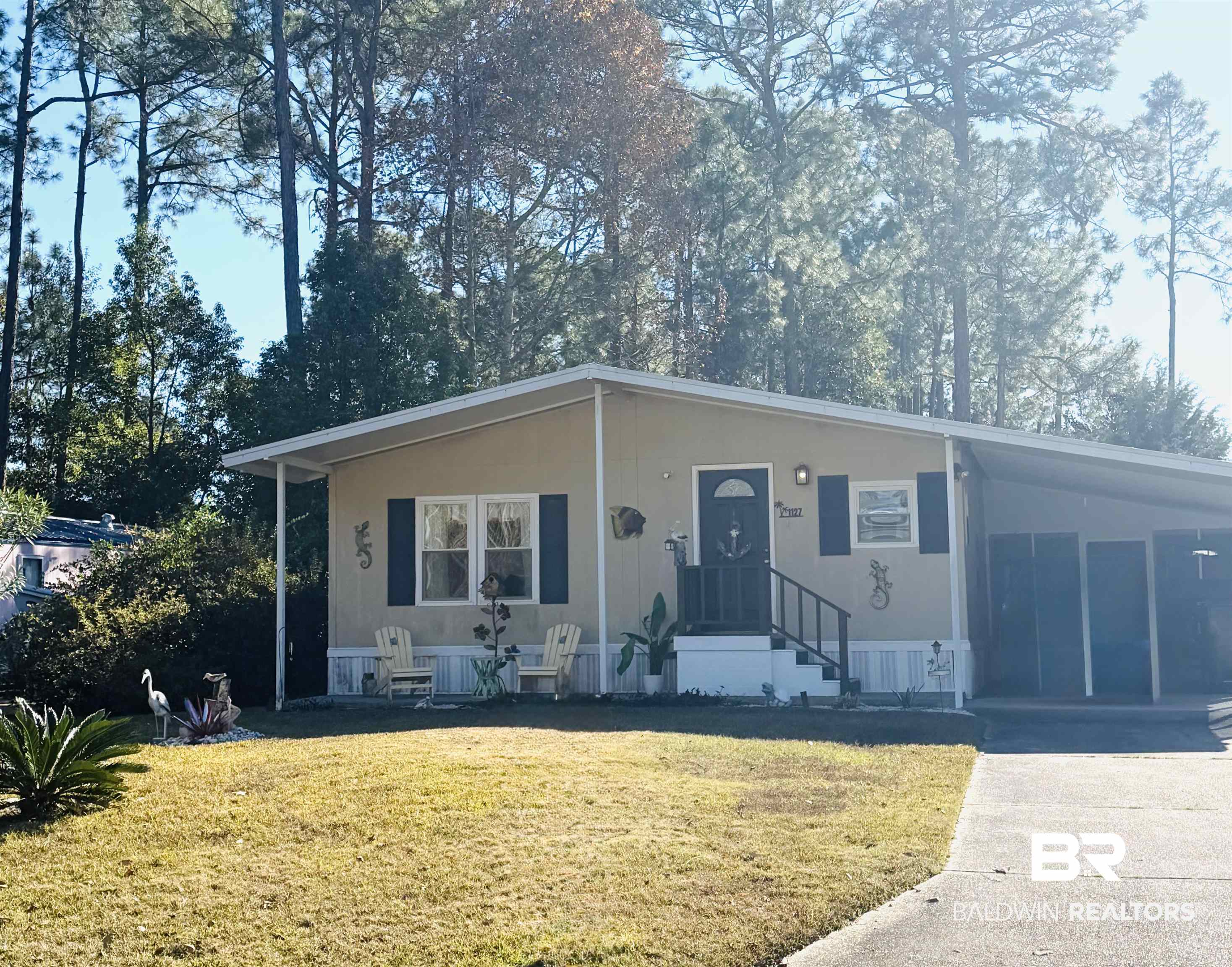 1127 Ridgewood Drive Lillian, AL 36549 - Photo 1 of 32 Manufactured / mobile home featuring an attached carport, a front lawn, and driveway