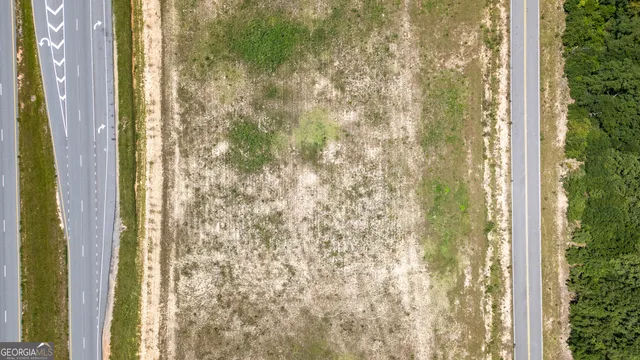 a view of a pool with a yard