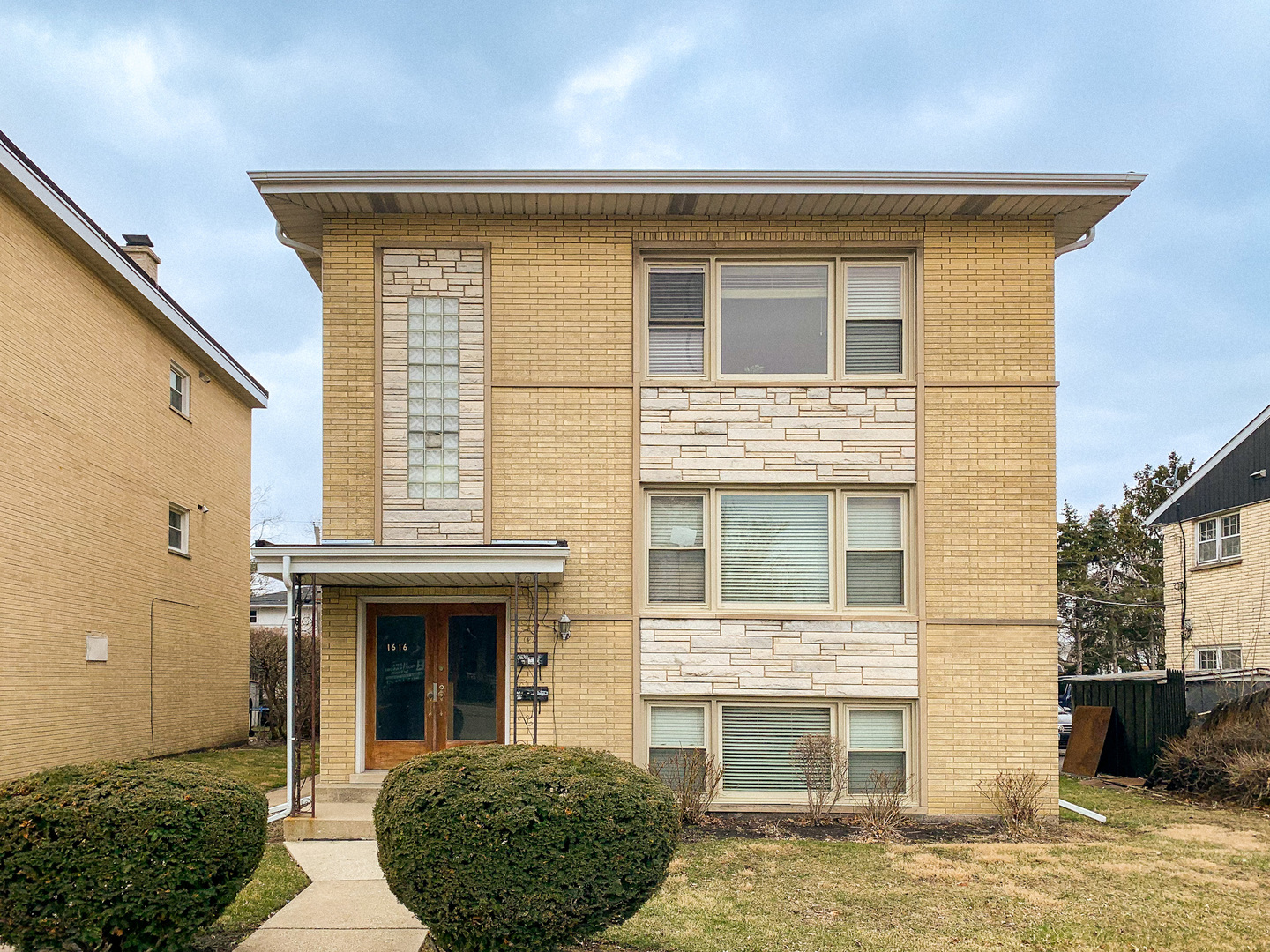 1616 South Mannheim Road Westchester, IL 60154 - Photo 1 of 13 a front view of a house with a yard