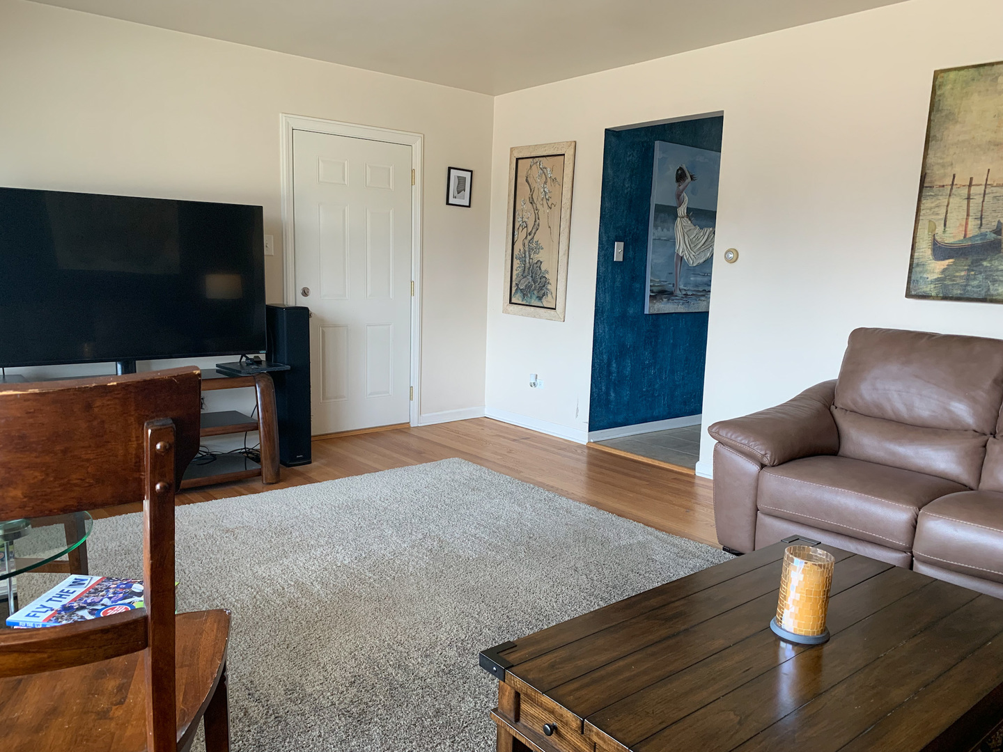 1616 South Mannheim Road Westchester, IL 60154 - Photo 3 of 13 a living room with furniture and a flat screen tv