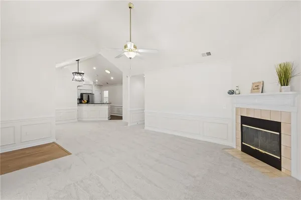 a view of a kitchen with a sink and a fireplace