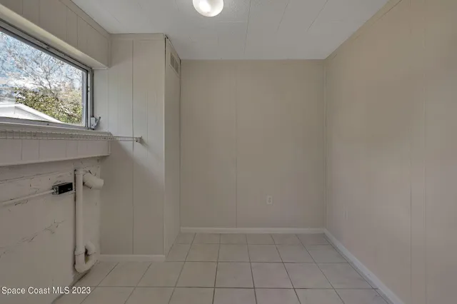 a view of an empty room and window