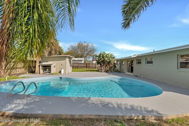 a view of a backyard with a garden