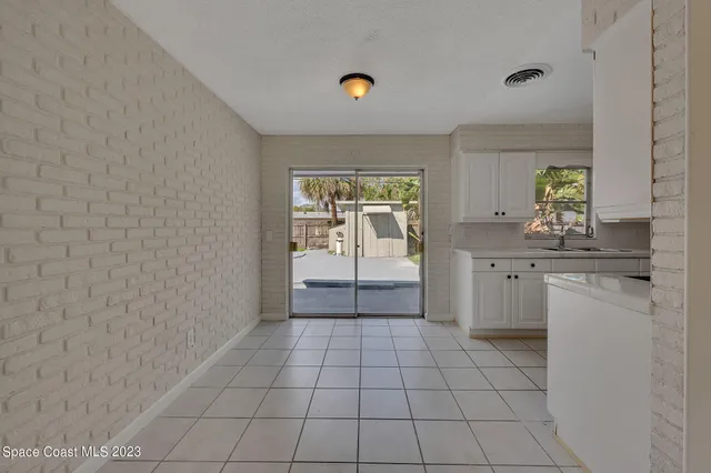 a view of a kitchen with a sink
