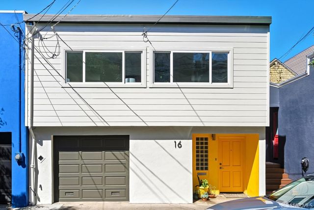 a black and white building with a outdoor space