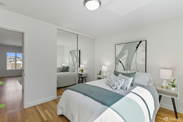 a bedroom with bed and a window