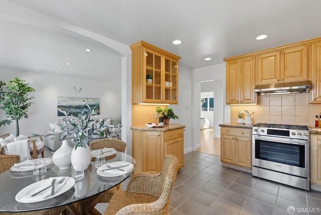 a kitchen with a table and chairs