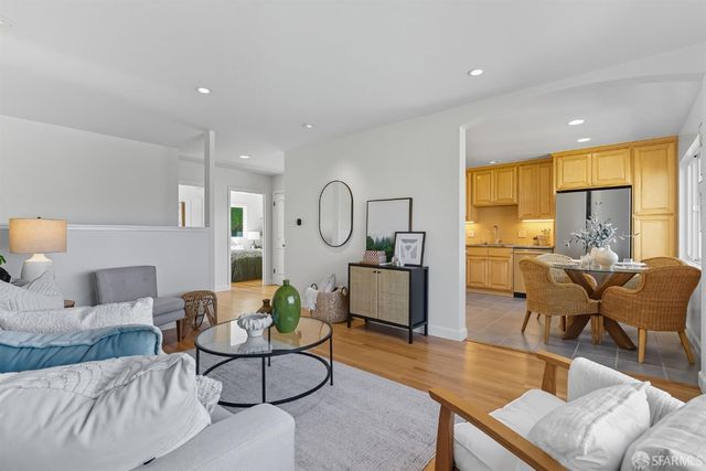 a living room with furniture or couch and a large window