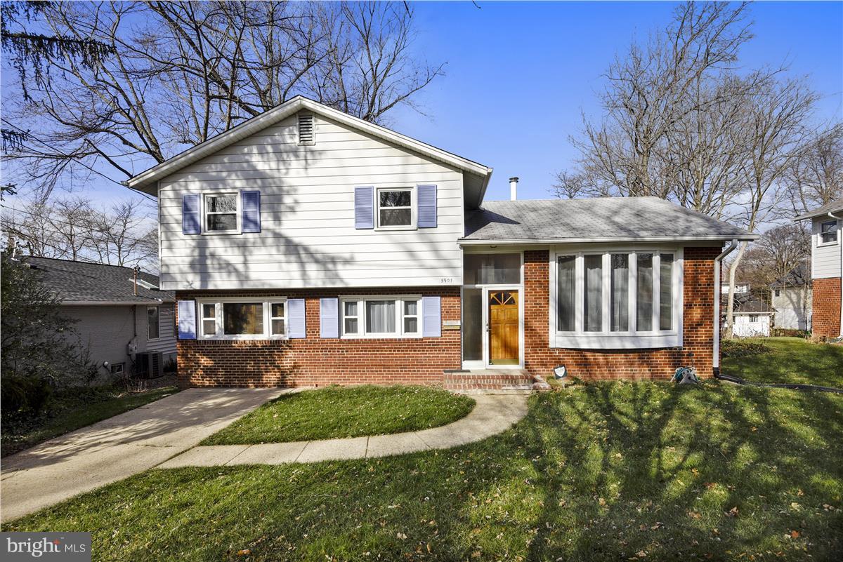 5901 Folkstone Road Bethesda, MD 20817 - Photo 1 of 30 a front view of a house with garden