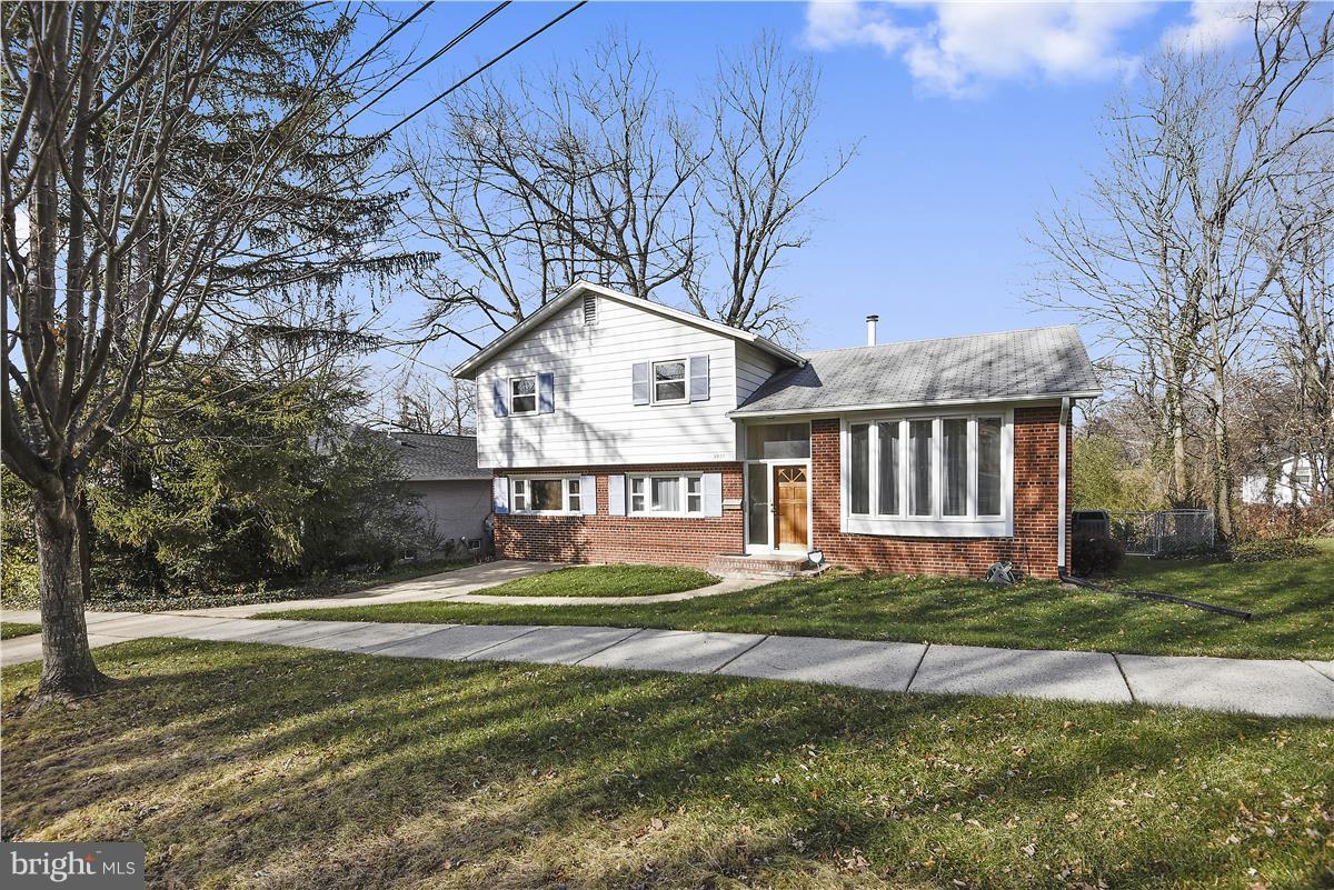 5901 Folkstone Road Bethesda, MD 20817 - Photo 2 of 30 a front view of a house with a yard