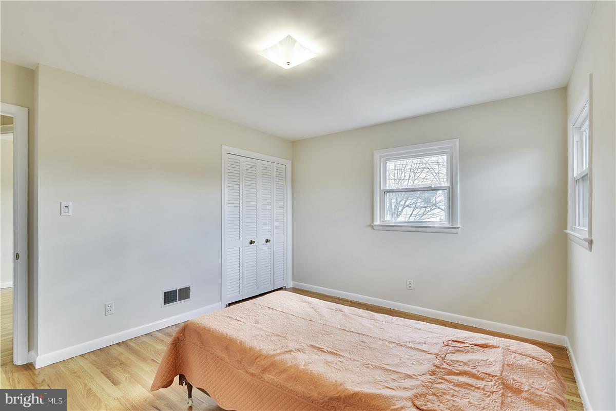 5901 Folkstone Road Bethesda, MD 20817 - Photo 15 of 30 a bedroom with a bed and a window
