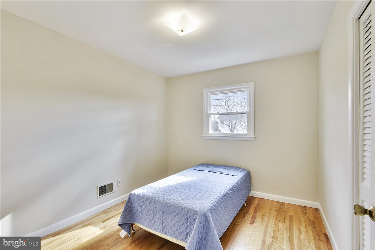 5901 Folkstone Road Bethesda, MD 20817 - Photo 16 of 30 a bedroom with a bed and a window