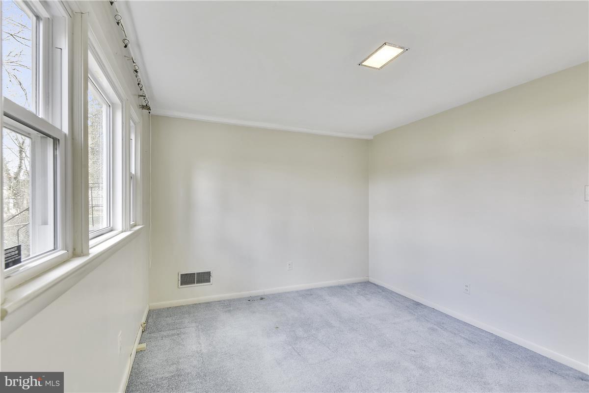 5901 Folkstone Road Bethesda, MD 20817 - Photo 19 of 30 a view of an empty room with a window