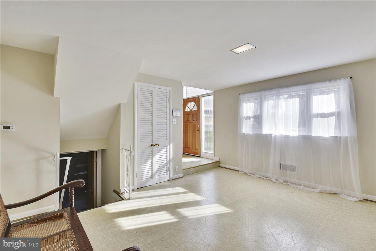 5901 Folkstone Road Bethesda, MD 20817 - Photo 23 of 30 a view of an empty room with a window