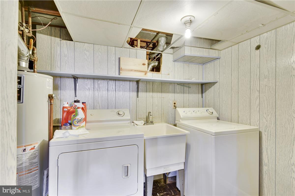 5901 Folkstone Road Bethesda, MD 20817 - Photo 28 of 30 a utility room with dryer and washer