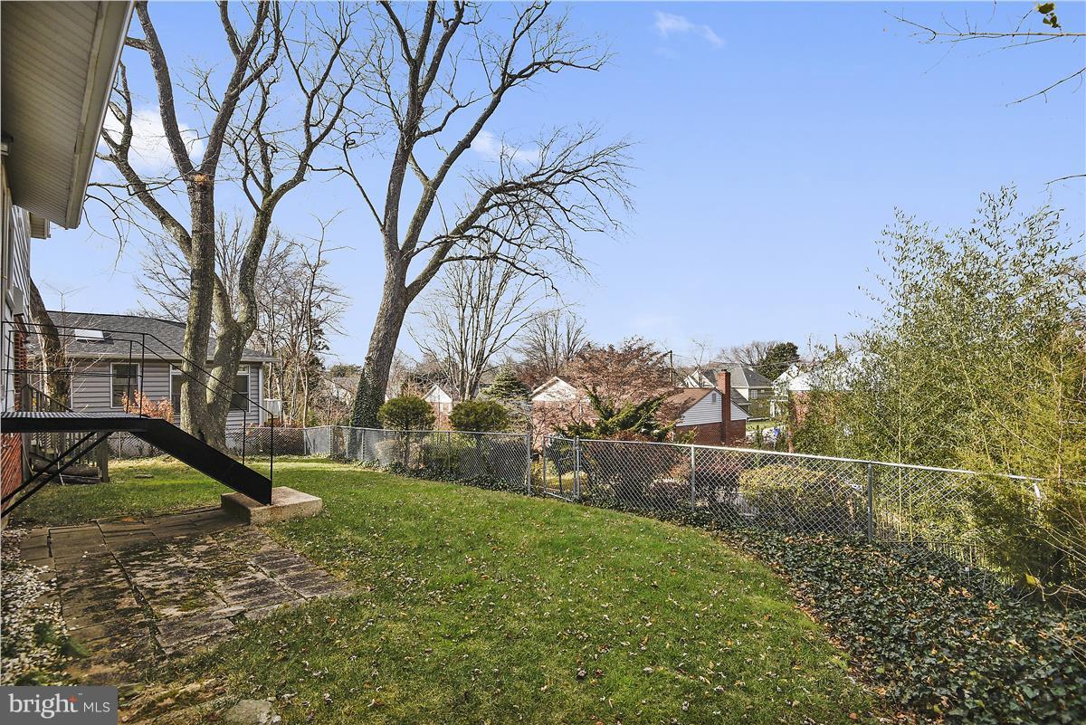 5901 Folkstone Road Bethesda, MD 20817 - Photo 30 of 30 a backyard of a house with lots of green space