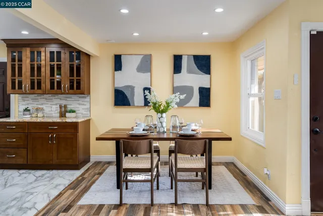 a kitchen with a table and chairs in it