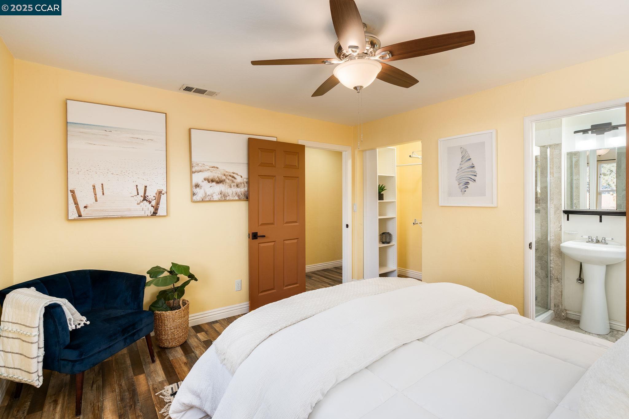 2941 Crawford Street Concord, CA 94518 - Photo 13 of 27 a bedroom with a bed and a chandelier